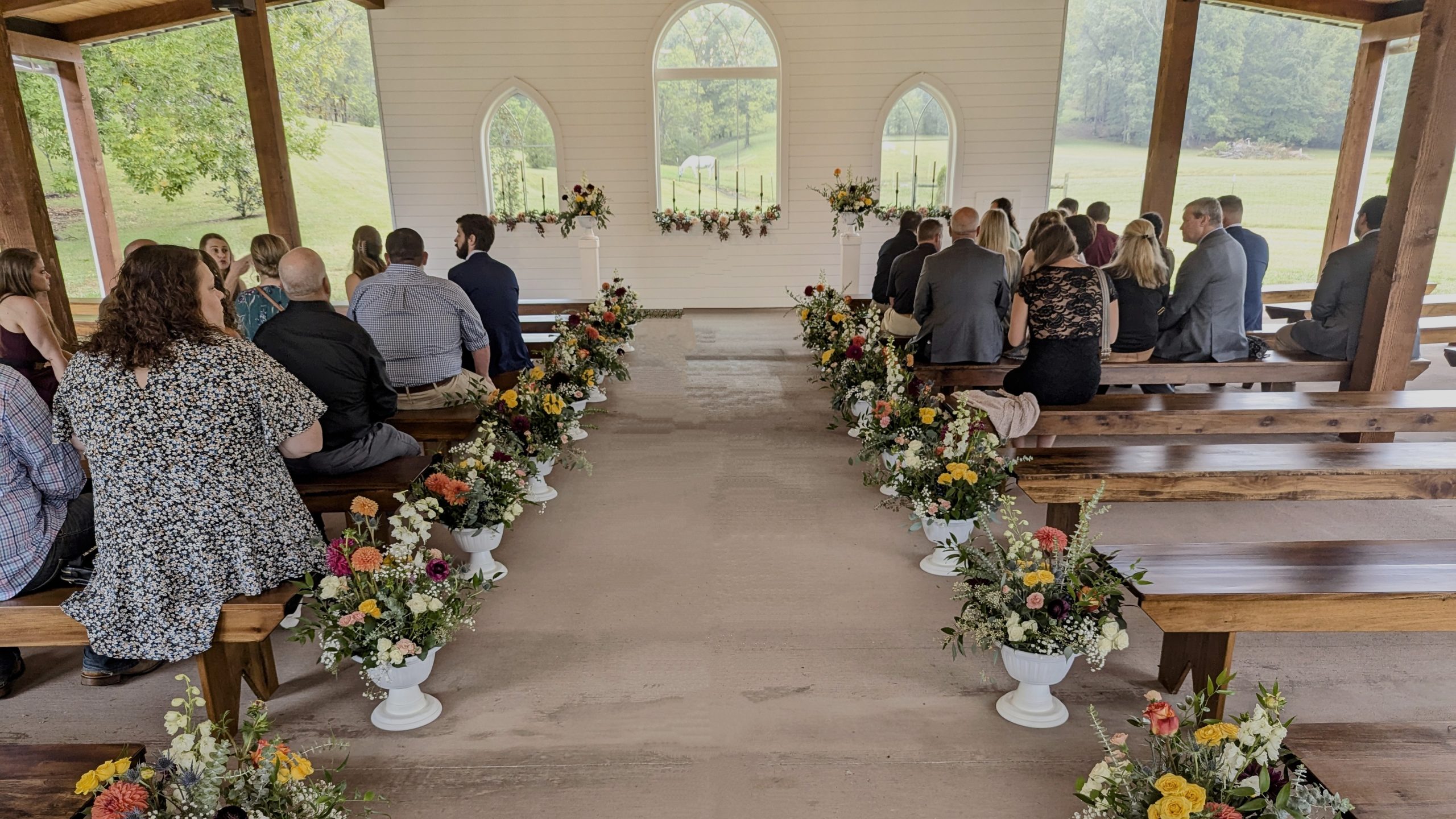 Outdoor wedding ceremony setup under the beautiful open sky.